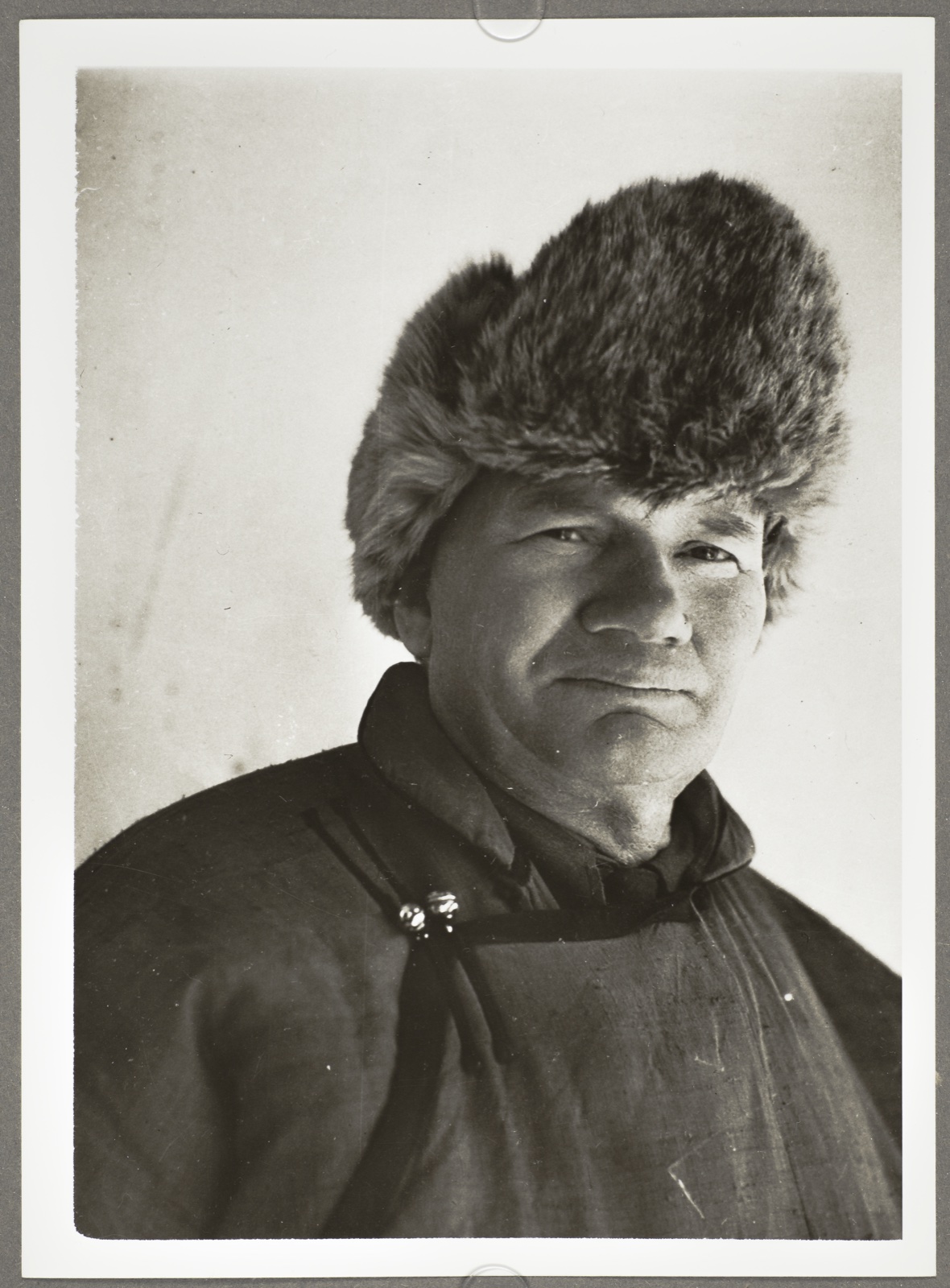 Studio-style seated portrait of Frans August Larson in Mongolian dress, Kalgan, ca. 1933–1934.